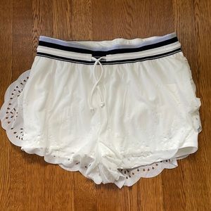 Free People Movement FP white shorts with cut outs size large nwot